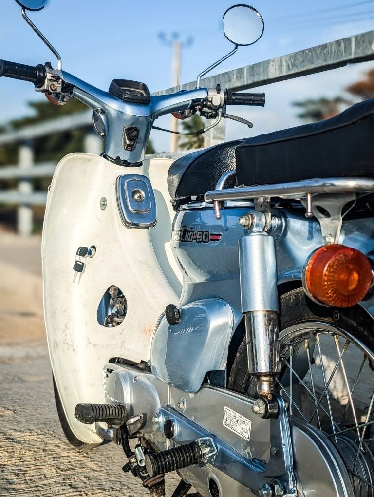 Silver Honda Cub restoration detail
