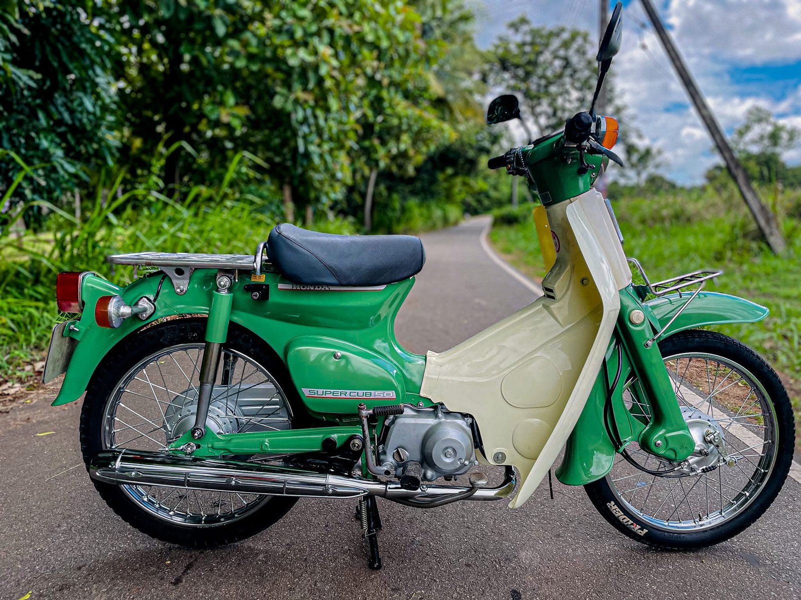 Restored green Honda Super Cub