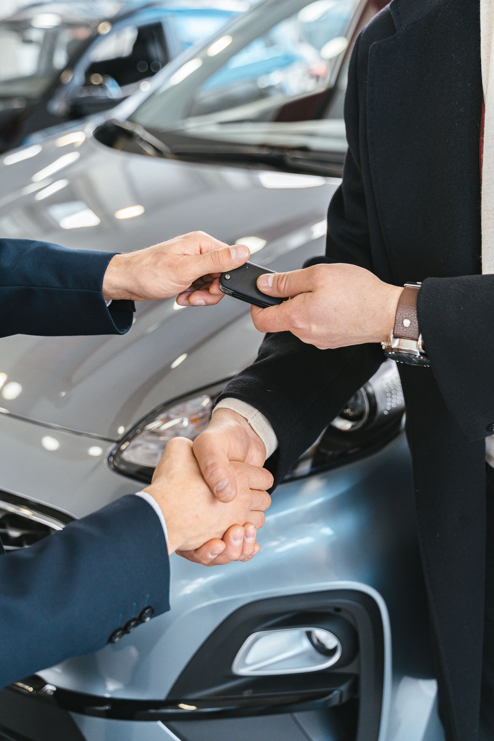 Completed vehicle being handed over to its owner with the keys